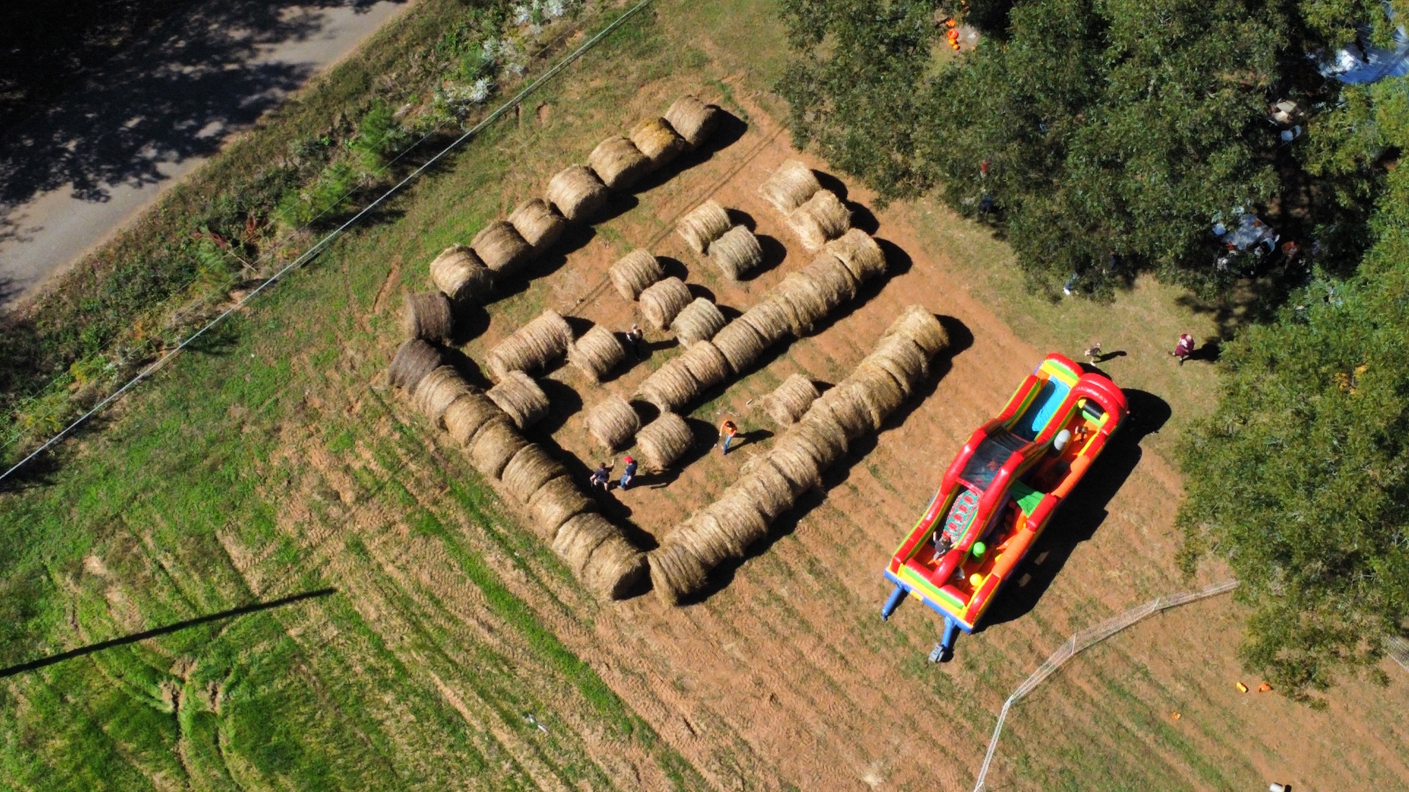 Hay bale maze and inflatable slide at the farm