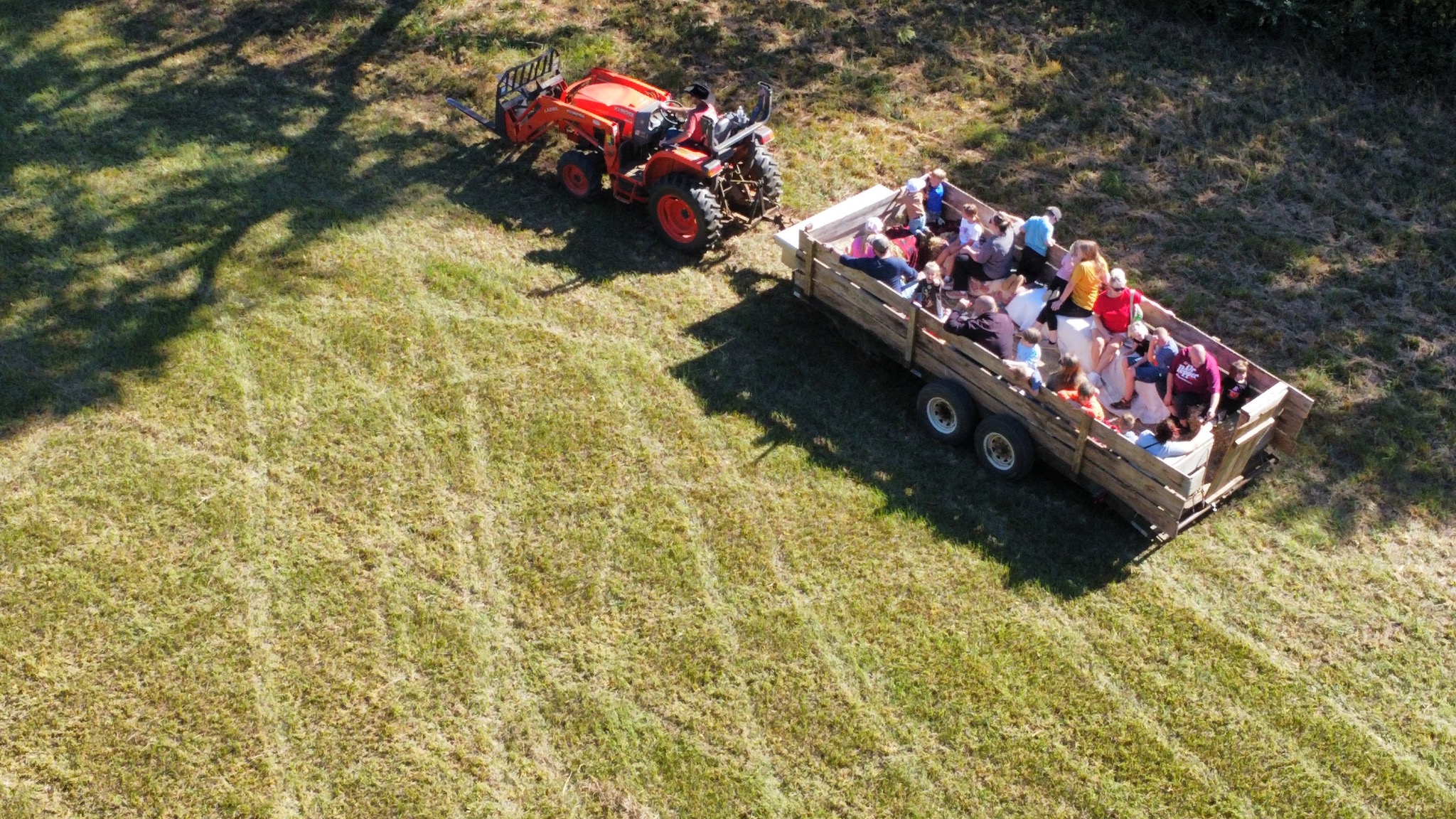 Tractor pulling a wagon full of visitors on a hay ride
